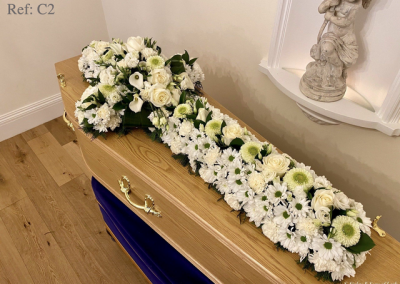 White cross funeral flowers.
